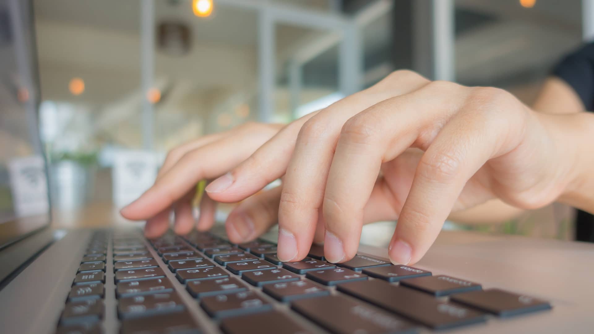 Privacy Policy > Header > Background Hands typing on a laptop keyboard, representing online learning or digital course registration.